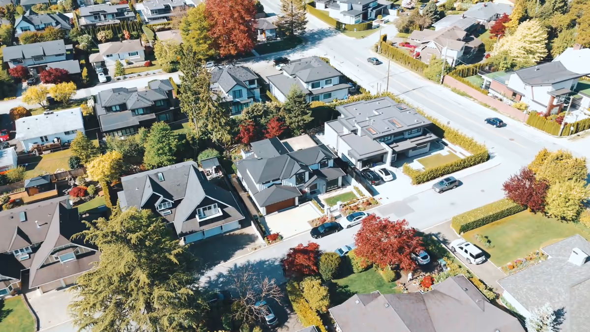 Aerial view of a modern white home in a leafy Forest Hill neighbourhood, filmed for Amin Meysami by Perseus Creative Studio.