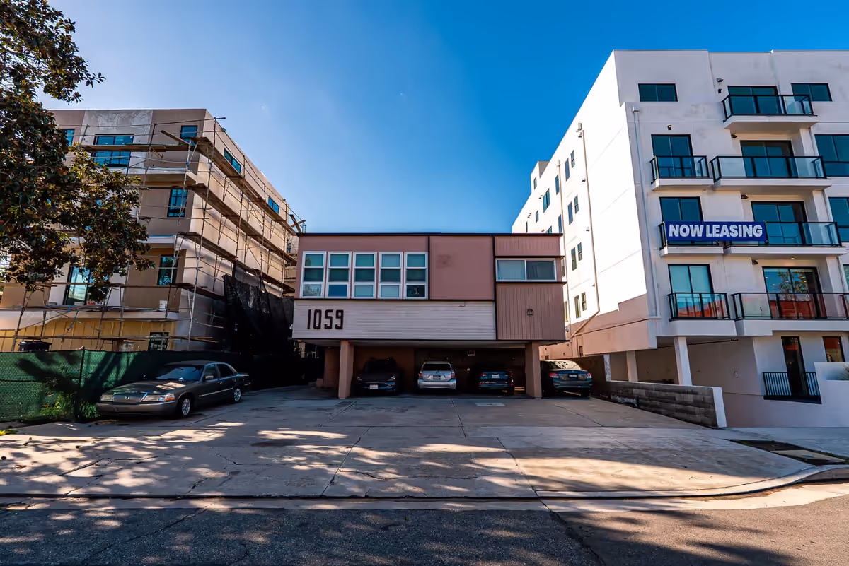 Street view of the 1059 S Corning St apartment building in Los Angeles, photographed for Michael Kamara Realtor by Perseus Creative Studio.