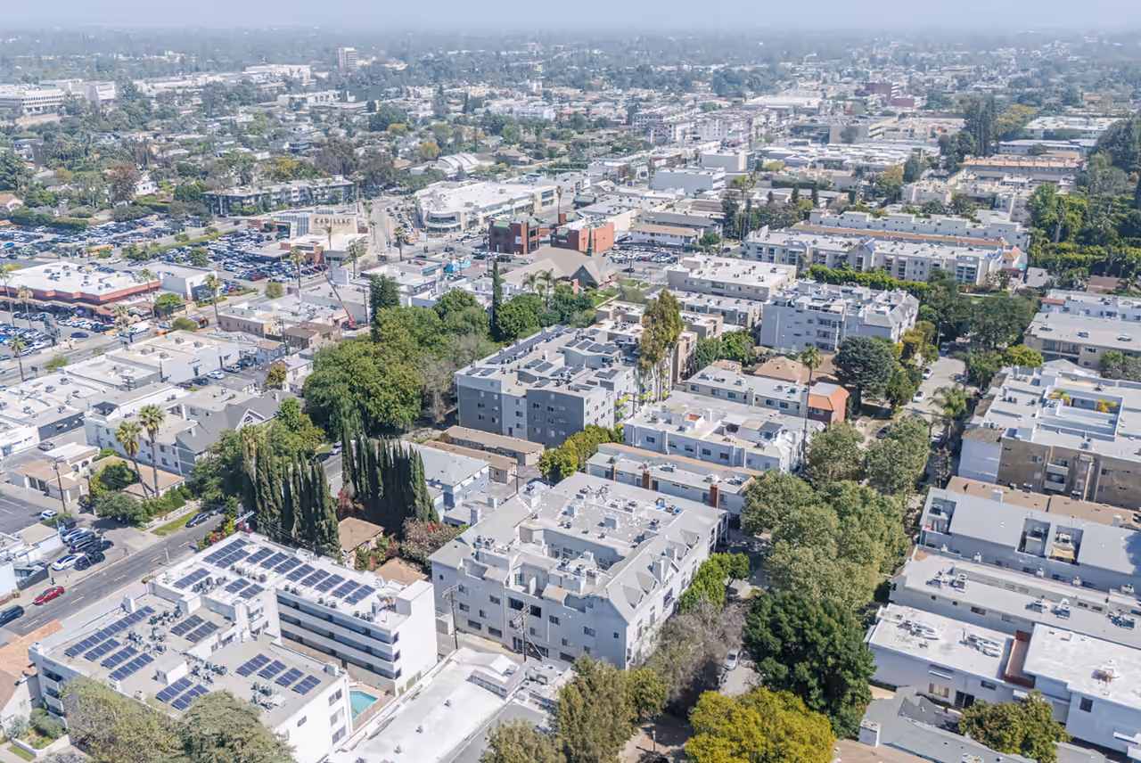 Aerial over the Sherman Oaks neighborhood showing the 14459 Benefit St property, captured for Michael Kamara Realtor by Perseus Creative Studio.