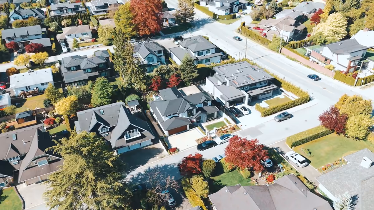 Aerial view of a modern white home in a leafy Forest Hill neighbourhood, filmed for Amin Meysami by Perseus Creative Studio.