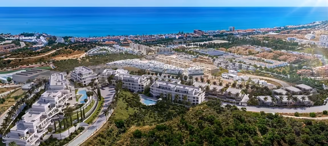Aerial of the white modern Vision Hills residential development overlooking the Mediterranean on the Costa del Sol in Marbella, produced for Bromley Estates Marbella by Perseus Creative Studio.